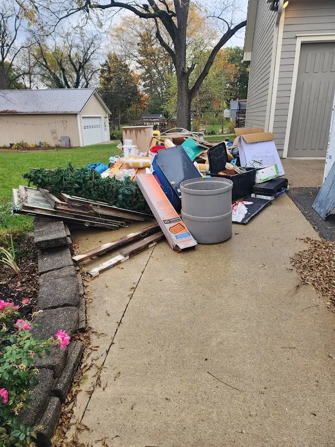 Dumpster being loaded with debris for Commercial Dumpster Rental in Batavia